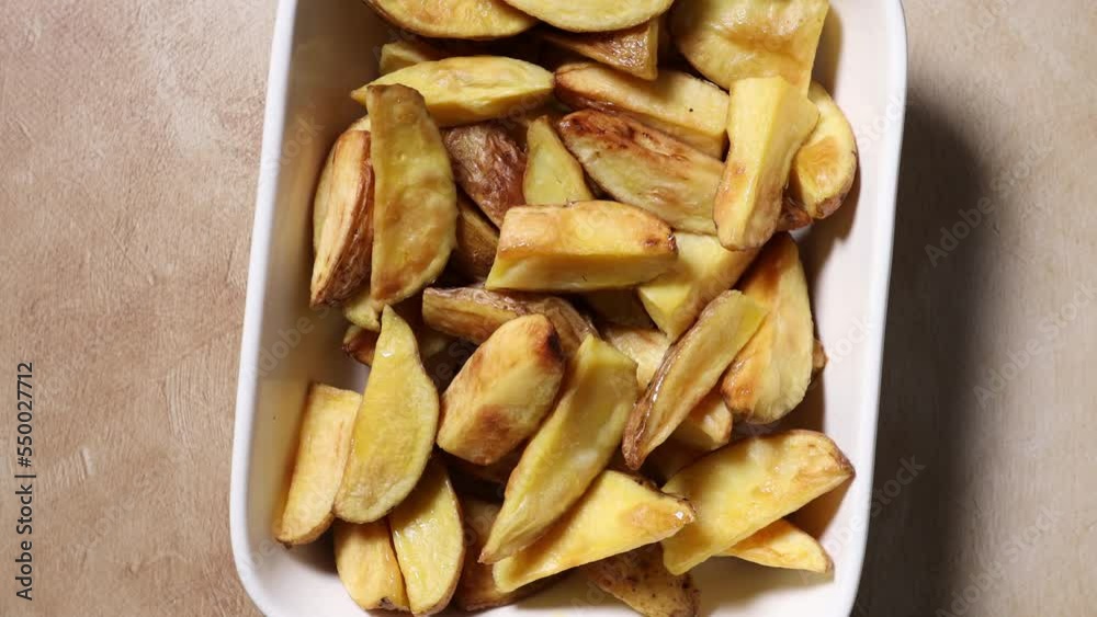 Dish with roasted potatoes slice rotation food