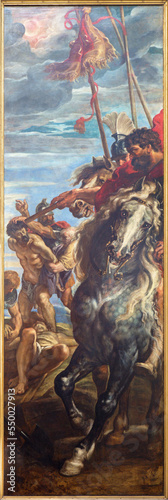 ANTWERP, BELGIUM - SEPTEMBER 4, 2013: The right panel from triptych Raising of the cross (1609 - 1610) by P. P. Rubens in the cathedral. Roman officer on horseback and crucifying the two thieves. photo
