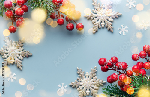 Fir Tree Decorations  On  Light Blue Background With  Copy Space