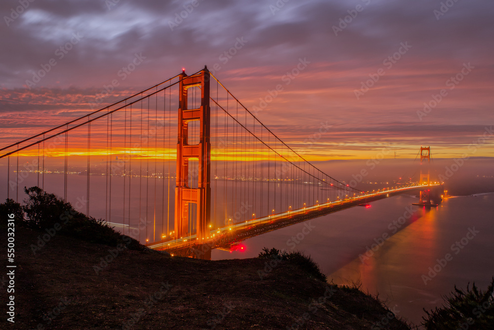San Francisco Landmark Illuminated During a Cloudy Orange Sunrise San Francisco Landmark Illuminated During a Cloudy Orange Sunrise