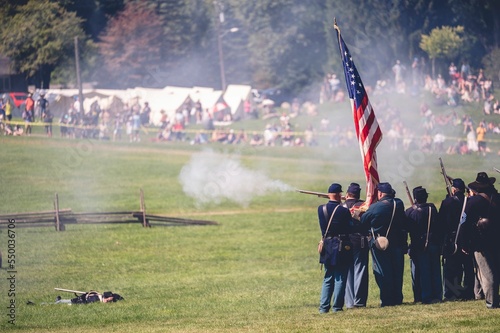 Fotografie Confederate reenactors fire their rifles during the Civil War reenactment