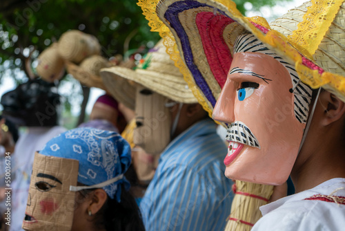 Unrecognizable people in disguise participating in the traditional festival of Masaya known as Torovenado photo