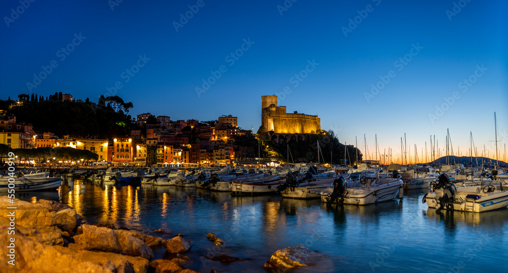 The village of Lerici by night with a view of the port and the medieval castle Lerici Italy