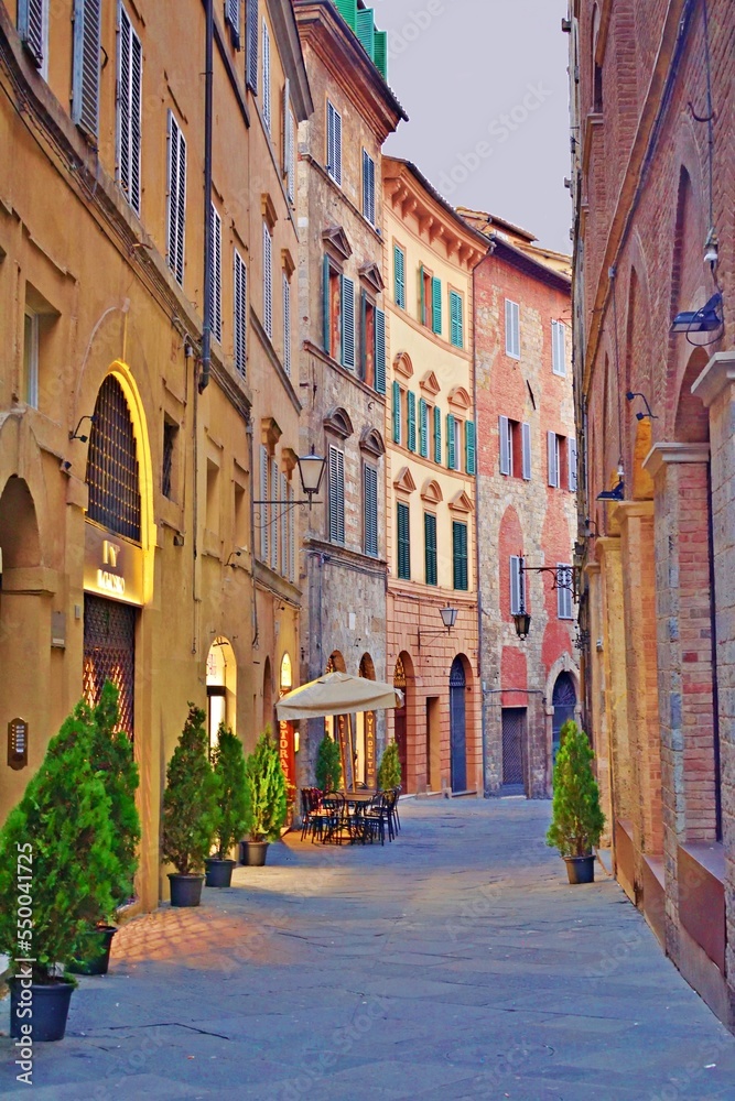 alley in the historic center of the city of Siena in Tuscany, Italy