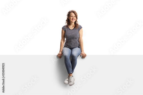Young casual female on a blank panel