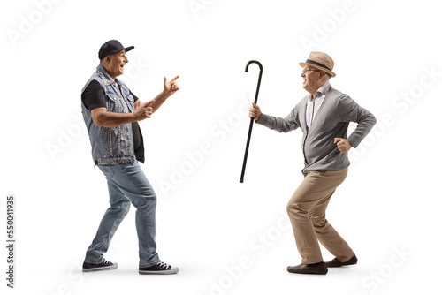 Full length profile shot of a two mature man dancing