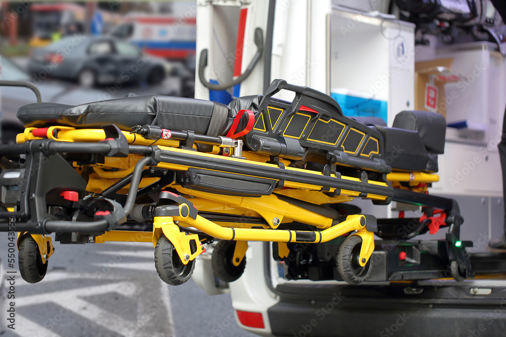 Fototapeta premium First aid stretcher and ambulance at road accident