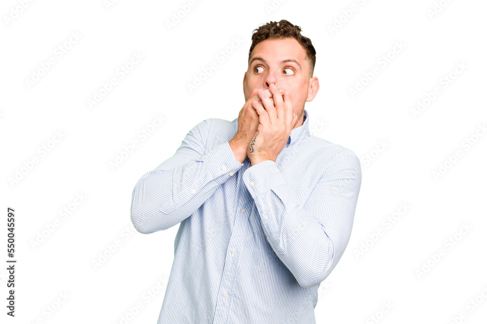 Young caucasian handsome man isolated thoughtful looking to a copy space covering mouth with hand. Young caucasian handsome man isolated thoughtful looking to a copy space covering mouth with hand.