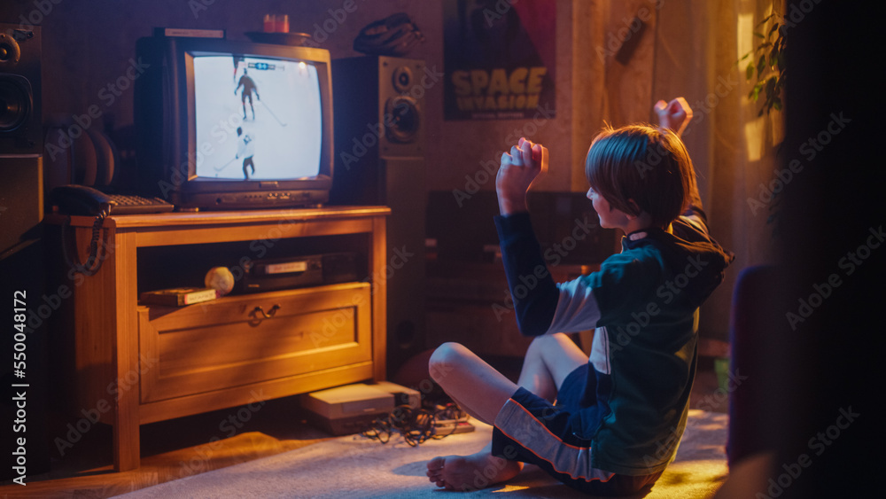 Nostalgic Retro Childhood Concept. Young Boy Watches Hockey Match on TV in His Stylish Room with Dated Interior. Supporting Favorite Team and Getting Excited When Professional Players Score a Goal.