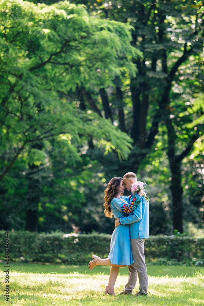 newlyweds kiss and hug after the ceremony in a local park. newlyweds kiss and hug after the ceremony in a local park.