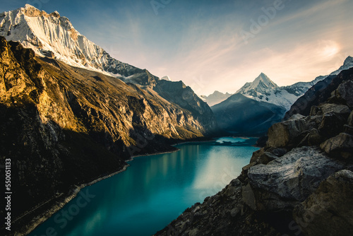 epic sunrise at Laguna Paron Turquoise Water Peruvian Andes Lake Between Mountains and Pyramid Peak, Trekking Travel Destination in the Cordillera Blanca, Peru photo