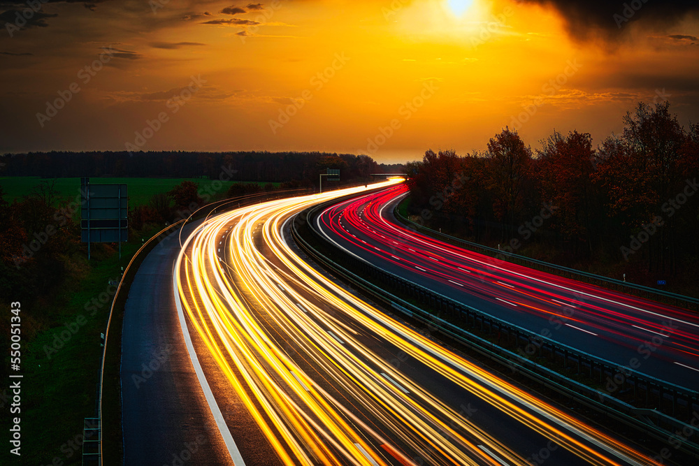 Langzeitbelichtung - Autobahn - Strasse - Traffic - Travel - Background - Line - Ecology -  Motorway - Highway - Night Traffic - Long Exposure - Cars Speeding - Lights - Sunset - High quality photo