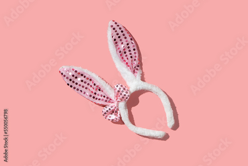 Bunny ear bezel on a pink background flat lay photo