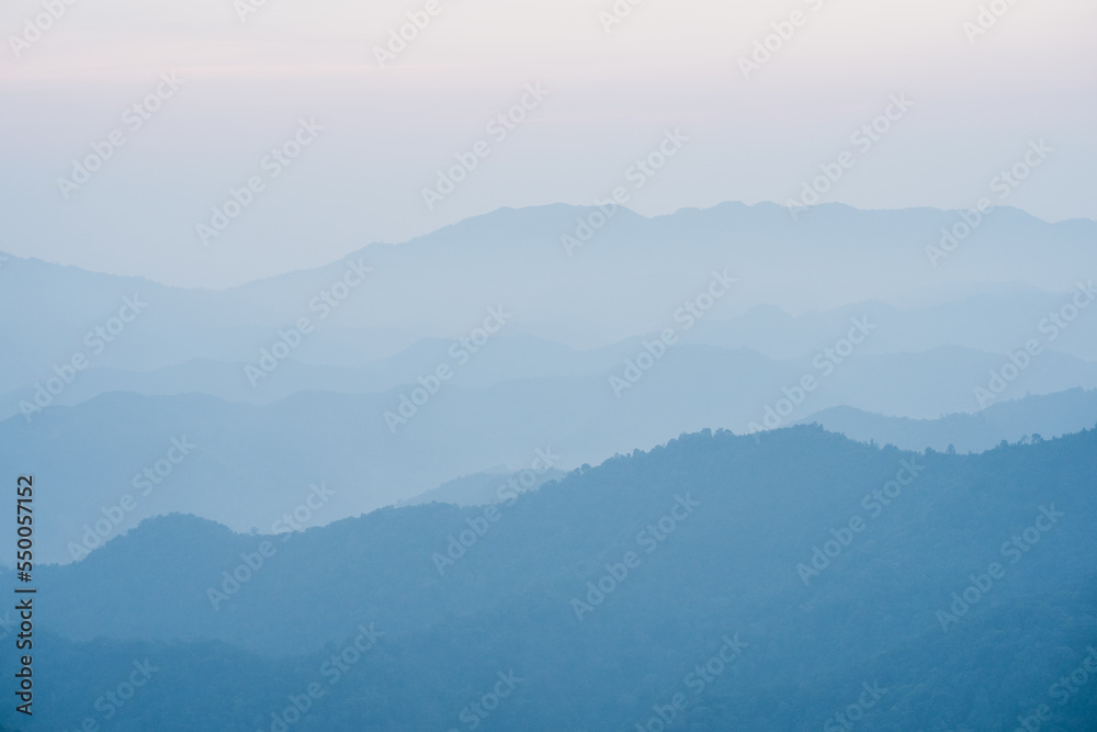 wide view  layer of mountain with sunrise background