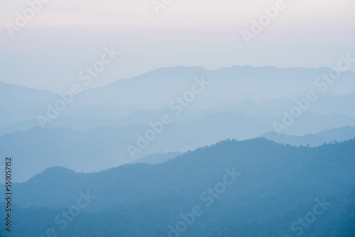 wide view layer of mountain with sunrise background
