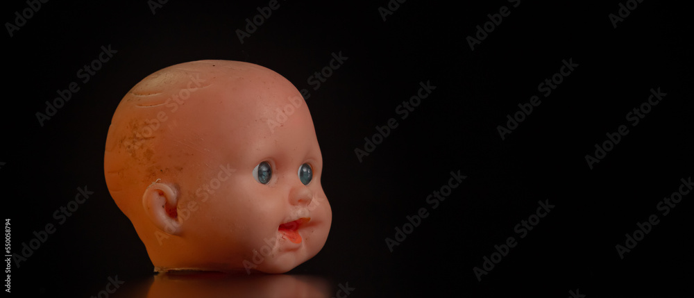 Damaged Dirty Doll head on black background isolated Damaged Dirty Doll head on black background isolated