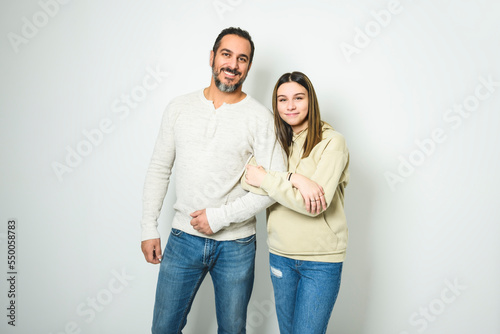 father and cute teen isolated on white on studio