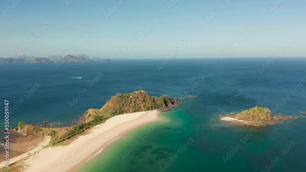 Aerial view of tropical island with sandy beach. Nacpan, El Nido, Palawan, Philippine Islands. Seascape with tropical beach and islands. Summer and travel vacation concept Aerial view of tropical island with sandy beach. Nacpan, El Nido, Palawan, Philippine Islands. Seascape with tropical beach and islands. Summer and travel vacation concept