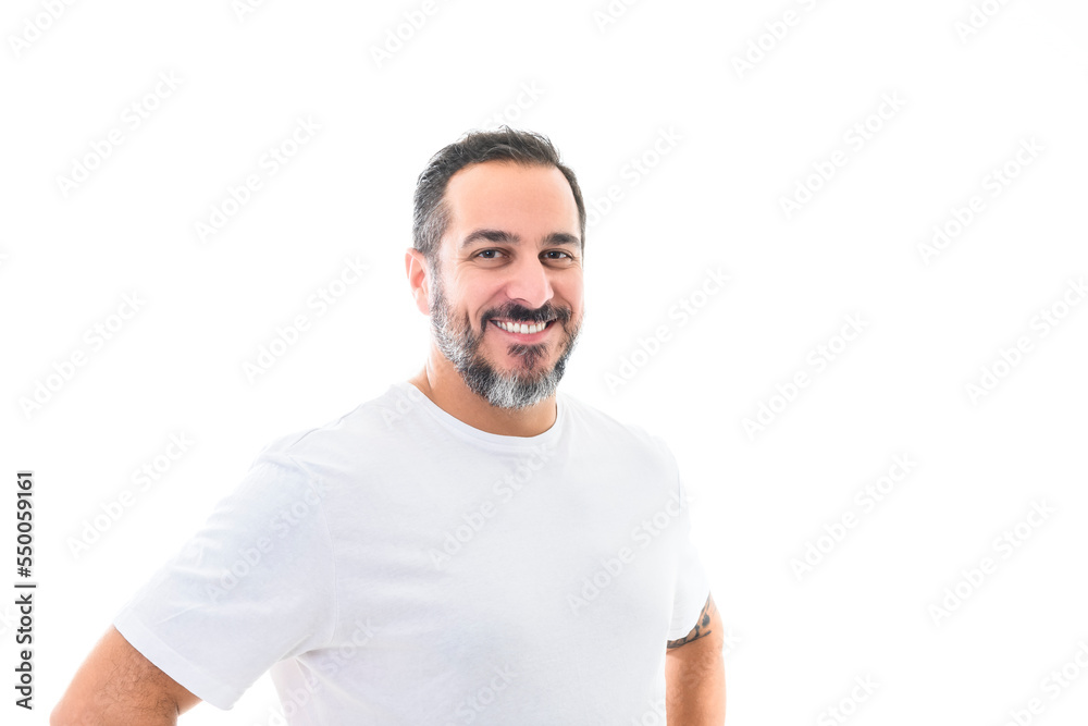 portrait of a bearded middle-aged man looking thoughtfully at the camera over a white studio background portrait of a bearded middle-aged man looking thoughtfully at the camera over a white studio background