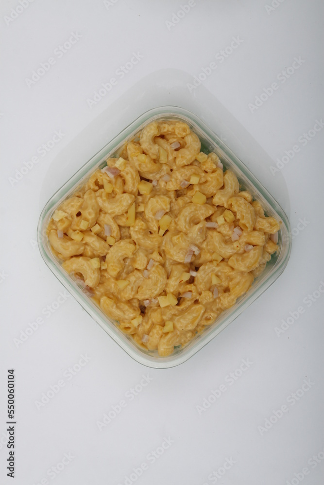 Top shot of mac and cheese and ham bits Top shot of mac and cheese and ham bits