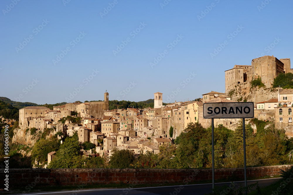 Sorano is a town and comune in the province of Grosseto, southern Tuscany. It as an ancient medieval hill town hanging from a tuff stone over the Lente River. `Italy. Road sign 