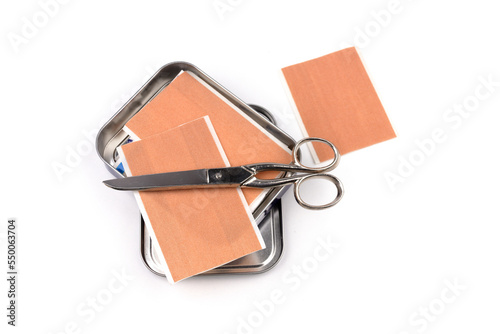 some band-aid isolated on white background with scissor and metal box