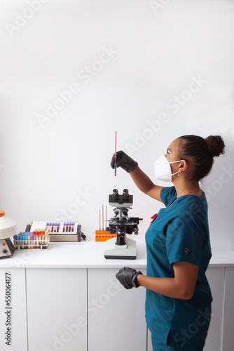 woman bio technitian checking ERS, portrait, select focus