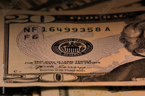 Closeup macro image of US 20 dollar bill and the Federal Reserve symbol photo