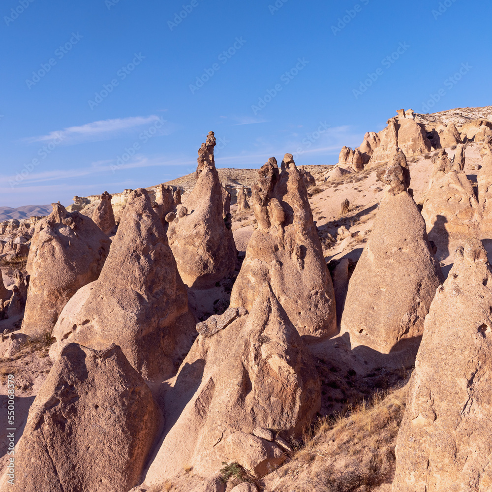 Fototapeta premium Unreal world of Cappadocia. Amazing hills in Cappadocia mountains. Traveling concept background