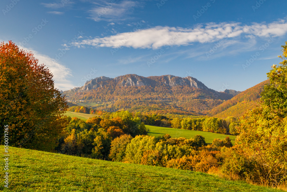 View of autumn landscape with rocky mountains in the background. The Vrsatec National Nature Reserve in the White Carpathian Mountains, Slovakia, Europe.