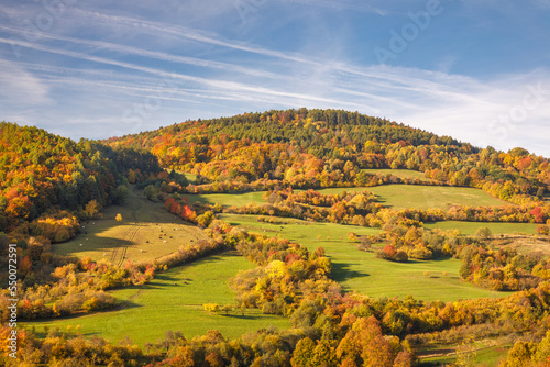 View of the autumn landscape with forests and pastures with cattle. The White Carpathian Mountains, Slovakia, Europe.