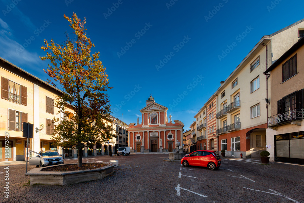 Boves, Cuneo, Piedmont, Italy - November 22, 2022: Piazza dell'Olmo (Elm tree square), in the background parish church of san Bartolomeo