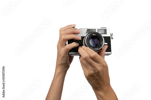 Female hands holding an old vintage camera with no background