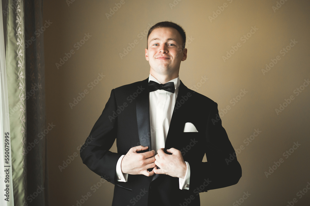 Beautiful man, groom posing and preparing for wedding Beautiful man, groom posing and preparing for wedding