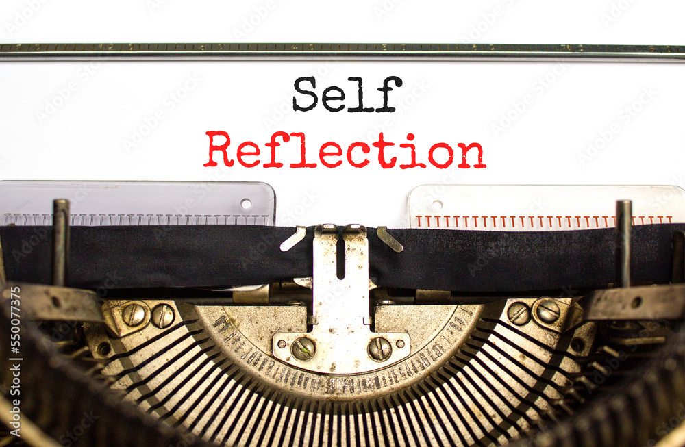 Self reflection symbol. Concept word Self reflection typed on retro old typewriter. Beautiful white background. Business psychological and self reflection concept. Copy space.