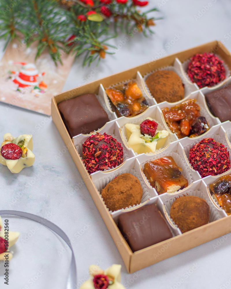 Assorted candies in a box. Christmas atmosphere Assorted candies in a box. Christmas atmosphere