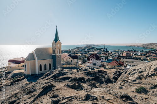 Blick über die Lüderitzbucht mit der Felsenkirche im Vordergrund (Lüderitz, Namibia) photo