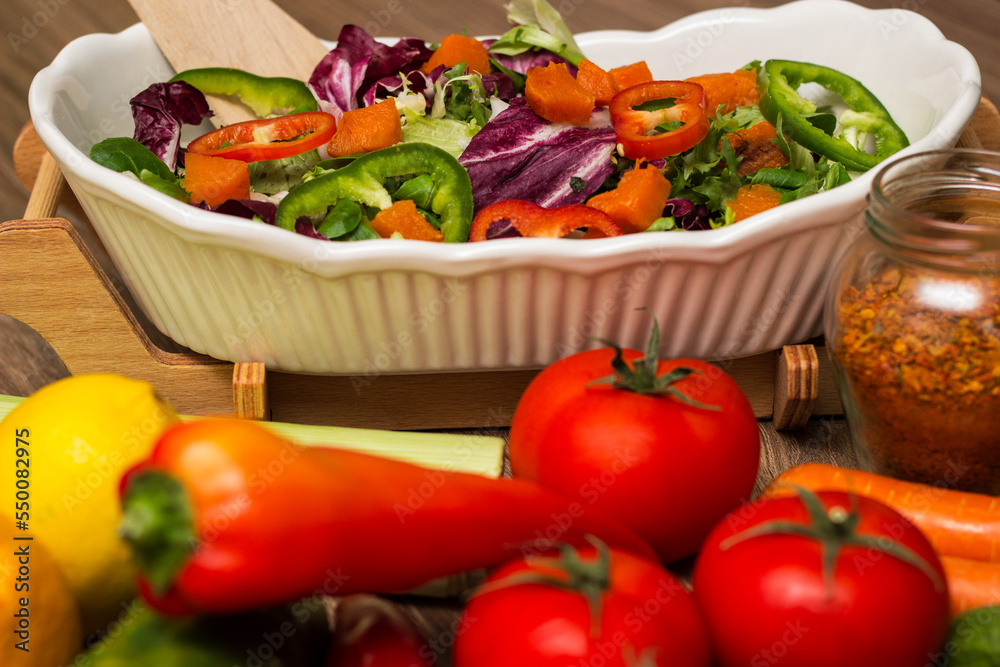 Healthy and fresh salad in bowl with vegetables and fruit Healthy and fresh salad in bowl with vegetables and fruit