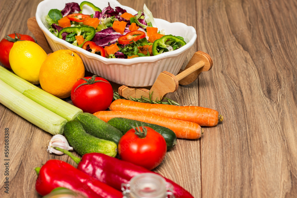 Healthy and fresh salad in bowl with vegetables and fruit Healthy and fresh salad in bowl with vegetables and fruit