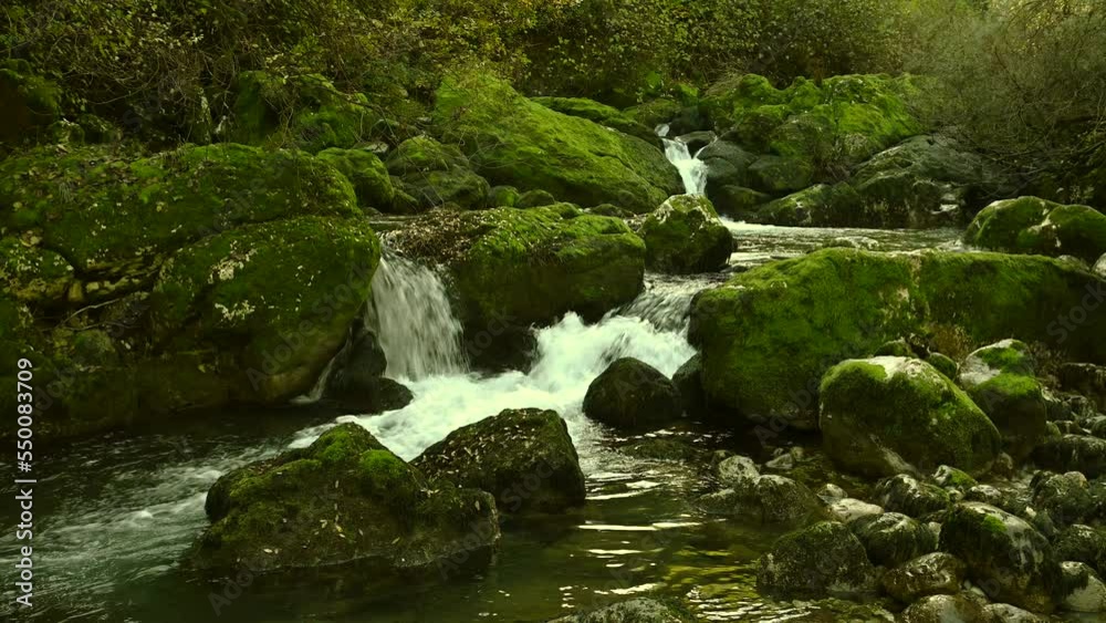 Waterfall in the mountain and rocks covered with moss. 4k Waterfall in the mountain and rocks covered with moss. 4k