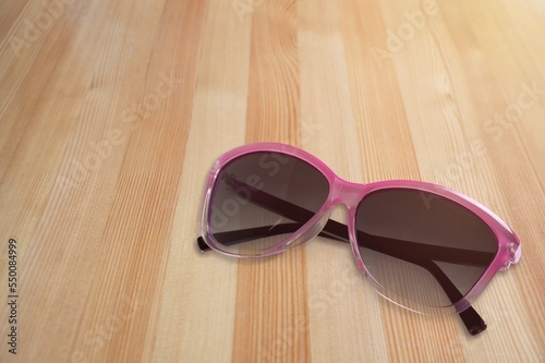 Beautiful trendy modern sunglasses on the desk