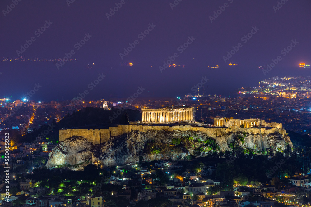 Illuminated Acropolis with Parthenon at night, Athens, Greece.