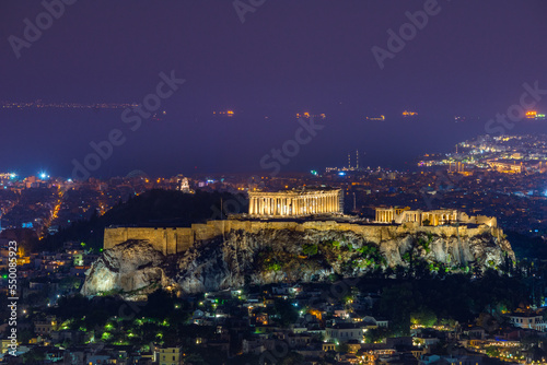Illuminated Acropolis with Parthenon at night, Athens, Greece.