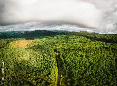 Cloudy sky over Gortin Glens Forest Park in Omagh Ireland photo