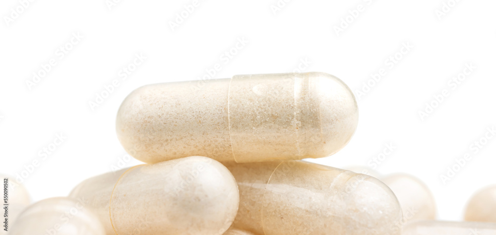 White medicine capsules, vitamin pills or drugs, medication treatment, health care concept, isolated on white White medicine capsules, vitamin pills or drugs, medication treatment, health care concept, isolated on white