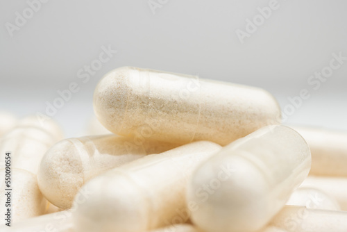 White medicine capsules, vitamin pills or drugs, medication treatment, health care concept