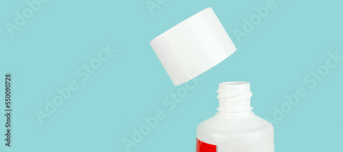 Top view toothpaste arranged on blue backdrop, dentistry concept. Concept of oral hygiene in the family.