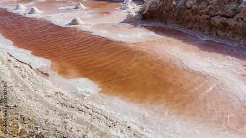 Salt lake in Tunisia Chott el Djerid red color of water from the salt minerals. Largest salt lake in the Sahara Desert. Tourist destination. Travel the world. Mysterious landscape. 