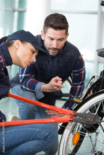 woman learning to open padlock bike