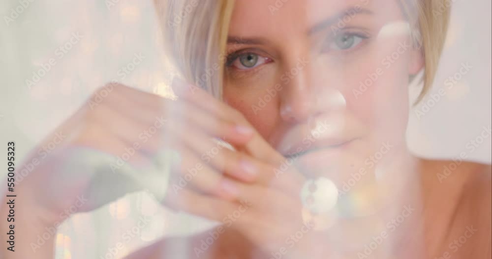 Woman, beauty and skincare, bokeh with cosmetic advertising and overlay on wellness and natural cosmetics portrait against studio background. Skin, face with facial and treatment with shine and glow. Woman, beauty and skincare, bokeh with cosmetic advertising and overlay on wellness and natural cosmetics portrait against studio background. Skin, face with facial and treatment with shine and glow.